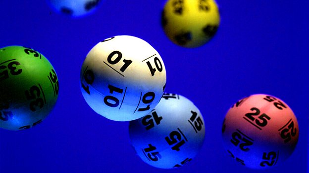 6 balls used in the UK National Lottery draws, in a deep blue background.