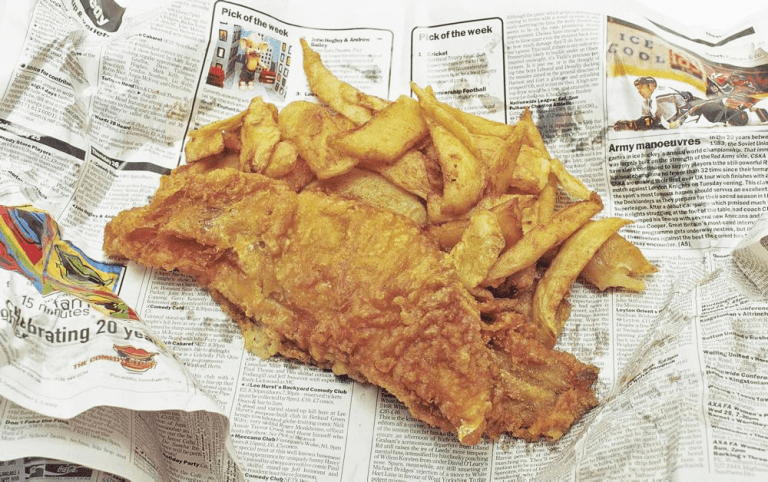 Fish and chips from a chip shop. Traditionally served in newspaper.