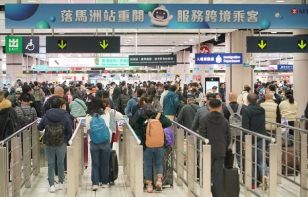 Photo of people queuing /  passing through the Hong Kong to Shenzen border in China.