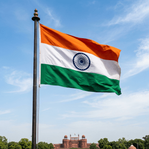 Indian flag with saffron, white, green stripes and blue Ashoka Chakra flying above Red Fort
